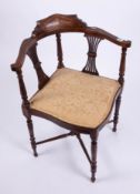 An Edwardian corner chair.