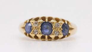 An 18ct sapphire and diamond set antique seven stone ring, size P.