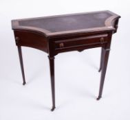 An early 20th Century rosewood writing desk fitted with swing drawers.