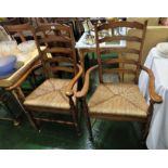 PAIR OF MID WOOD LADDER BACK CARVER CHAIRS WITH RUSH WOVEN SEATS
