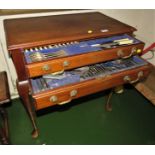 MAHOGANY TWO DRAWER CANTEEN STANDING ON CABRIOLE LEGS WITH CONTENTS OF SILVER PLATED CUTLERY (A/F)