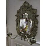 SMALL DECORATED BRASS WALL MIRROR WITH BEVELLED PANEL AND CANDLE SCONCES