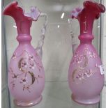 TWO FLORALLY DECORATED PINK GLASS VASES