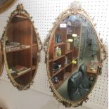 PAIR OF OVAL WALL MIRRORS IN BRASS EFFECT FRAMES