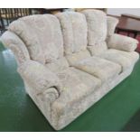 THREE SEATER SOFA IN BEIGE PATTERNED UPHOLSTERY