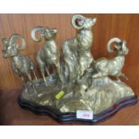 CAST BRASS GROUP OF RAMS ON ROCKY OUTCROP OF WOODEN BASE