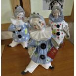 THREE TENGRA FIGURES OF CLOWNS WITH INSTRUMENTS