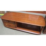 ERCOL MID ELM COFFEE TABLE OF OBLONG FORM WITH TWO DRAWERS TO ONE SIDE, OPEN UNDER TIER TO THE