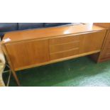 A. H. MCINTOSH & CO LTD TEAK SIDEBOARD WITH THREE CENTRAL DRAWERS AND SINGLE CUPBOARD TO EACH END