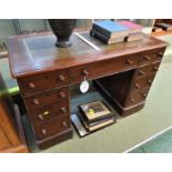 LADIES PEDESTAL MAHOGANY DESK OF NINE DRAWERS WITH GREEN LEATHER SCRIBER, STANDING ON BROWN CHINA