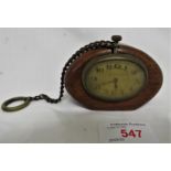 SMALL BRASS CLOCK WITH DIAL MARKED 'MINERVA MOTORS', SET IN OVAL MAHOGANY MOUNT