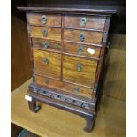 JAPANESE HARDWOOD CABINET OR KODANSU, NINE DRAWERS, BRASS CARRYING HANDLES, TYPICAL PIERCED CARVING,