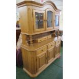 MODERN COMPOSITE PINE DRESSER, ARCH TOP WITH THREE LEADED GLAZED DOORS AND THREE SMALL DRAWERS, BASE