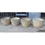 FOUR COMPOSITE STONE HALF BARREL STYLE PLANTERS