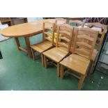 LARGE LIGHT OAK D-END EXTENDING DINING TABLE AND SIX LADDER BACK CHAIRS