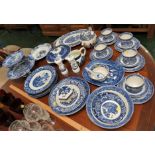 BLUE AND WHITE WILLOW PATTERNED AND OTHER BLUE AND WHITE CHINA WARE INCLUDING CUPS, SAUCERS, TEAPOT,