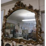 LARGE SHAPED OVERMANTLE STYLE MIRROR IN DECORATIVE GILT EFFECT FRAME