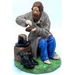 Russian Gardner bisque porcelain figure of peasant man in grey overcoat sprinkling salt on a slice