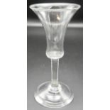 A late 18th century tall wine glass with bell shape bowl, straight stem, conical foot, height 17cm