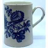A restored early Caughley style porcelain mug painted in blue with flowers, indistinct painted