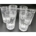 Six large glass tumblers, of which three have decagonal slice cuts to the lower half, and three have