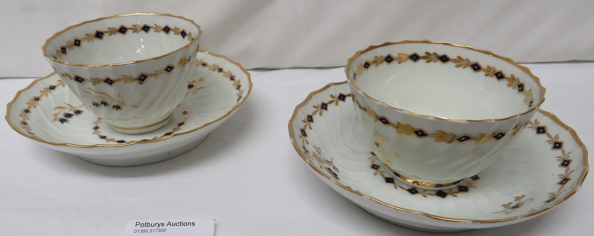 Two 19th century wrythen porcelain tea bowls and saucers, probably Worcester, each similarly