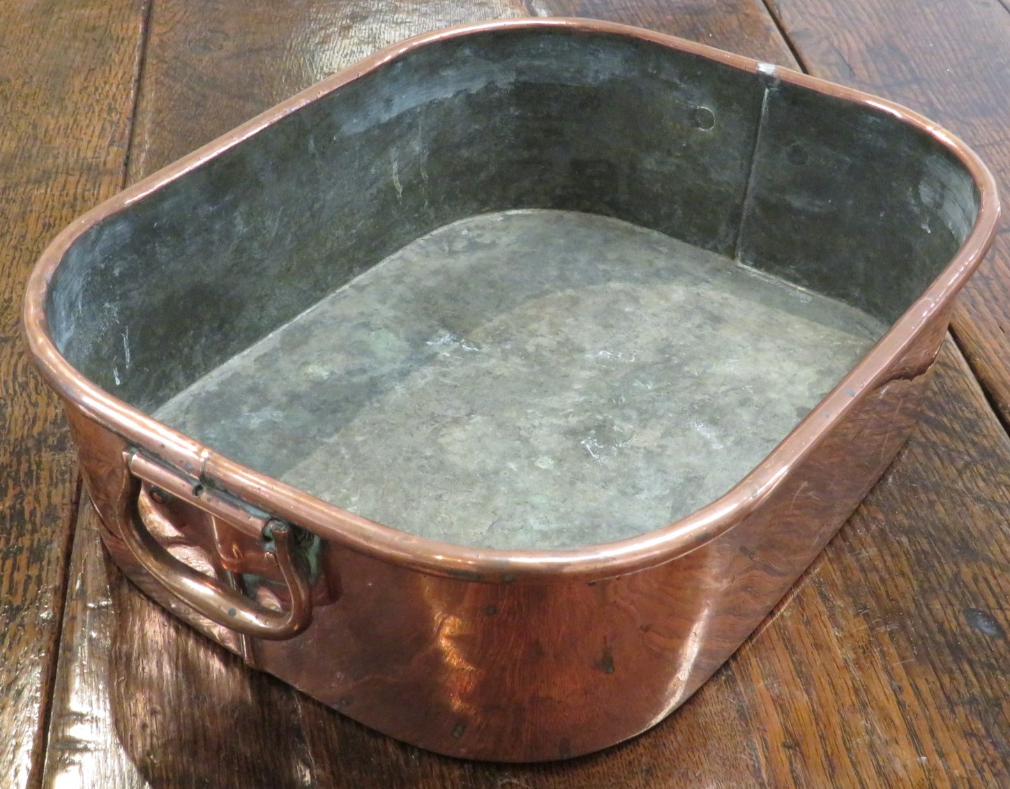 Copper bain marie with two hinged handles, length 29.5cm, width 37.5cm, depth 10.5cm, stamped orb