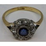 Sapphire and diamond floret setting ring, central sapphire (diameter 5mm) surrounded by ten small