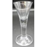 A 19th century tapering wine glass, the stem with a single tear air bubble, stepped circular foot,