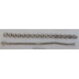White metal bracelet of wavy links, length about 19.5cm, 0.8 ozt, acid test positive for silver; and
