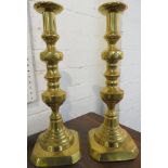 Pair of large brass Victorian ejector candlesticks, baluster column on square base with chamfered