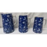 Newport Pottery Burslem Chintz set of three graduated jugs, the tallest 19cm, blue transfer