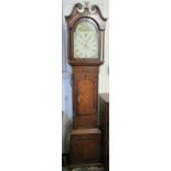 An early 19th century thirty-hour oak and mahogany long case clock, enamelled dial (diameter 29.5cm)