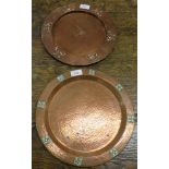 Two copper Arts and Crafts plates - the first with a planished centre and embossed rim, diameter