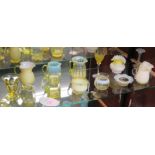 Fifteen assorted overlaid yellow and vaseline glass jars, jugs, vases, etc