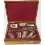 Oak canteen of silver cutlery comprising twelve dinner forks (combined 32 ozt), twelve dessert forks