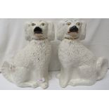 Pair of Victorian seated Staffordshire spaniels, height 31.5cm