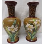 Pair of Doulton Lambeth vases of baluster form with flared necks, the ochre bodies decorated with