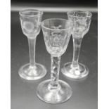 Three Jacobite influence wine glasses - (1) the bowl with hexagonal slice cuts at the join to the