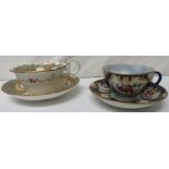 Two 19th century cups and saucers - the first decorated in underglaze blue scales and decorated with