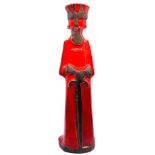David Sharp Rye Pottery figural candle holder modelled as a king with sword, red glaze, height 34.