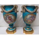Pair of Sevres style porcelain urns, scrolled handles with moulded rope garlands, celeste blue