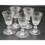 A near set of three 19th century wine glasses with conical bowls and stems with single blade knop,