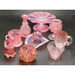 A selection of nine ruby and cranberry glass ornaments including custard glasses, jugs, crimped