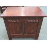 First quarter 20th century oak twin panel coffer with carved tongue and dart frieze and strap