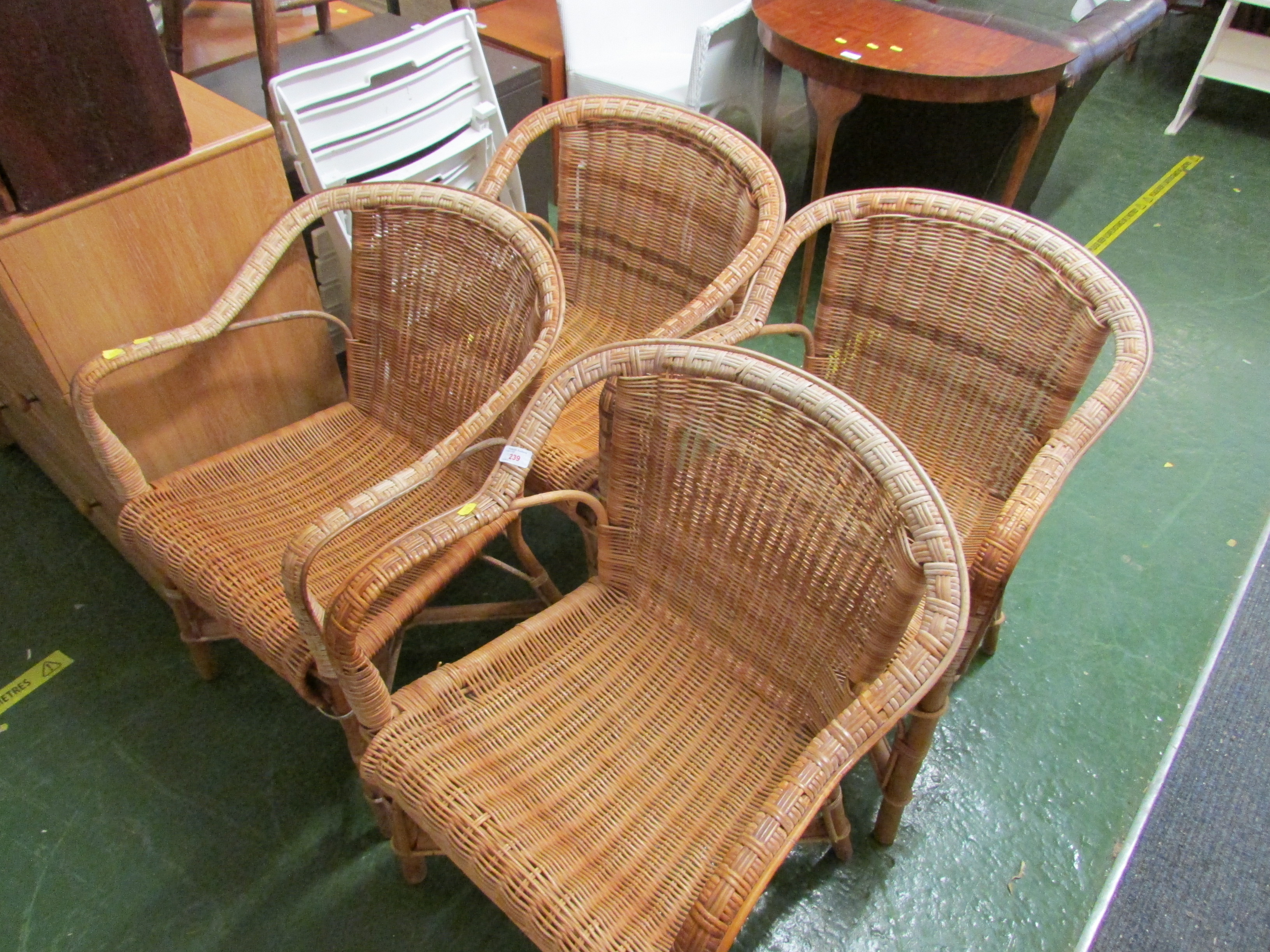 FOUR CANE FRAMED WICKER SEATED CHAIRS