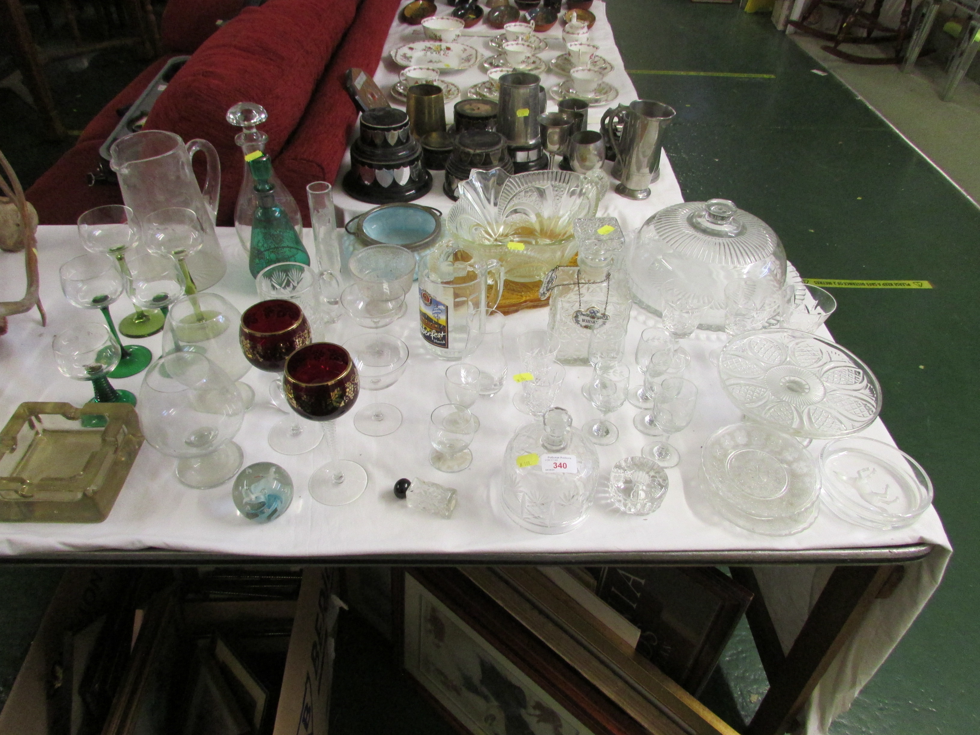 MIXED GLASS WARE INCLUDING DRINKING VESSELS, STOPPER DECANTERS, LIDDED SERVING PLATTER, PAPER WEIGHT