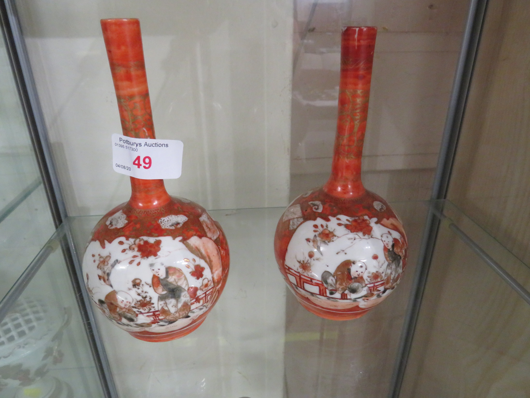 PAIR OF CHINESE PORCELAIN STEM VASES DECORATED IN RED AND PAINTED WITH PANELS OF BIRDS AND FIGURES