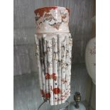 A CHINESE OR JAPANESE CYLINDRICAL CERAMIC VASE WITH APPLIED BAMBOO MOULDING, DECORATED WITH BIRDS