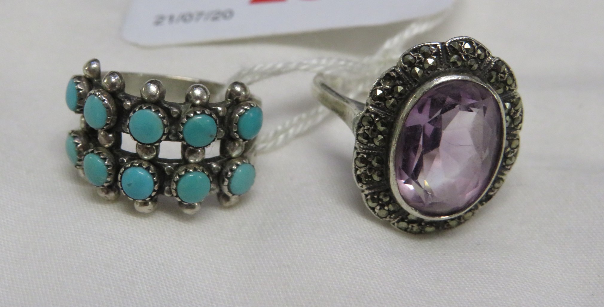 WHITE METAL RING SET WITH TURQUOISE AND STAMPED STERLING, AND A WHITE METAL AMETHYST AND MARCASITE